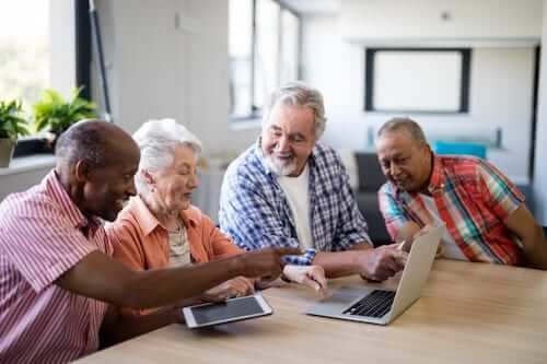 Senior citizens looking at the laptop