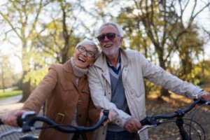 Senior couple riding bicycles and enjoying outdoor activities