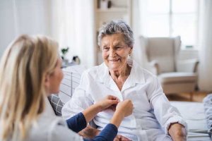 Old woman having medical checkup with her private doctor