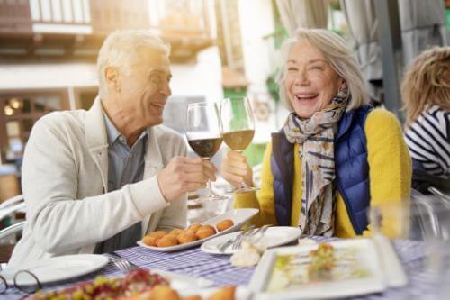 Senior couple having private lunch in retirement community