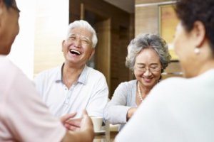 Senior couples chatting and laughing together