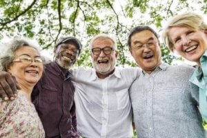Senior citizens take a selfie and laugh together