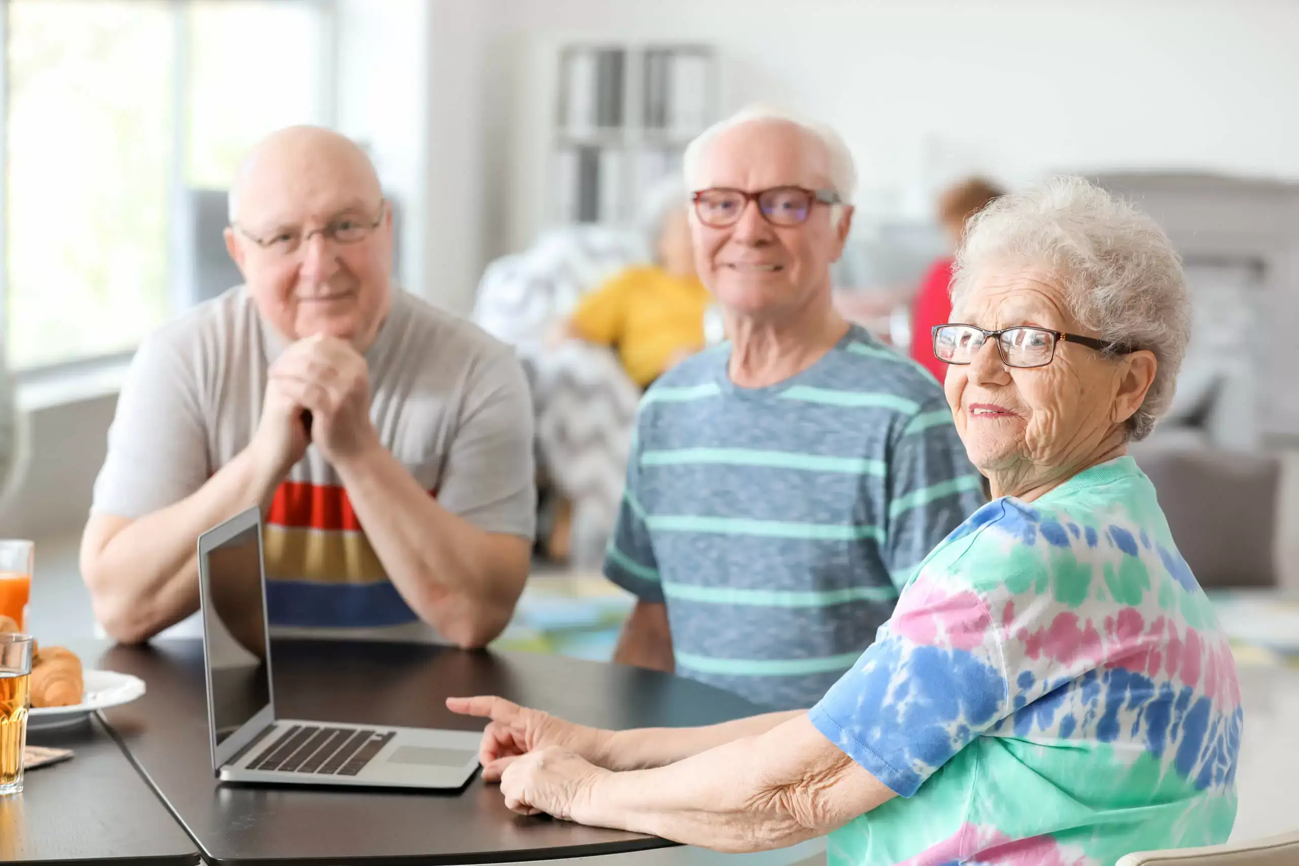 Senior citizen watching a laptop