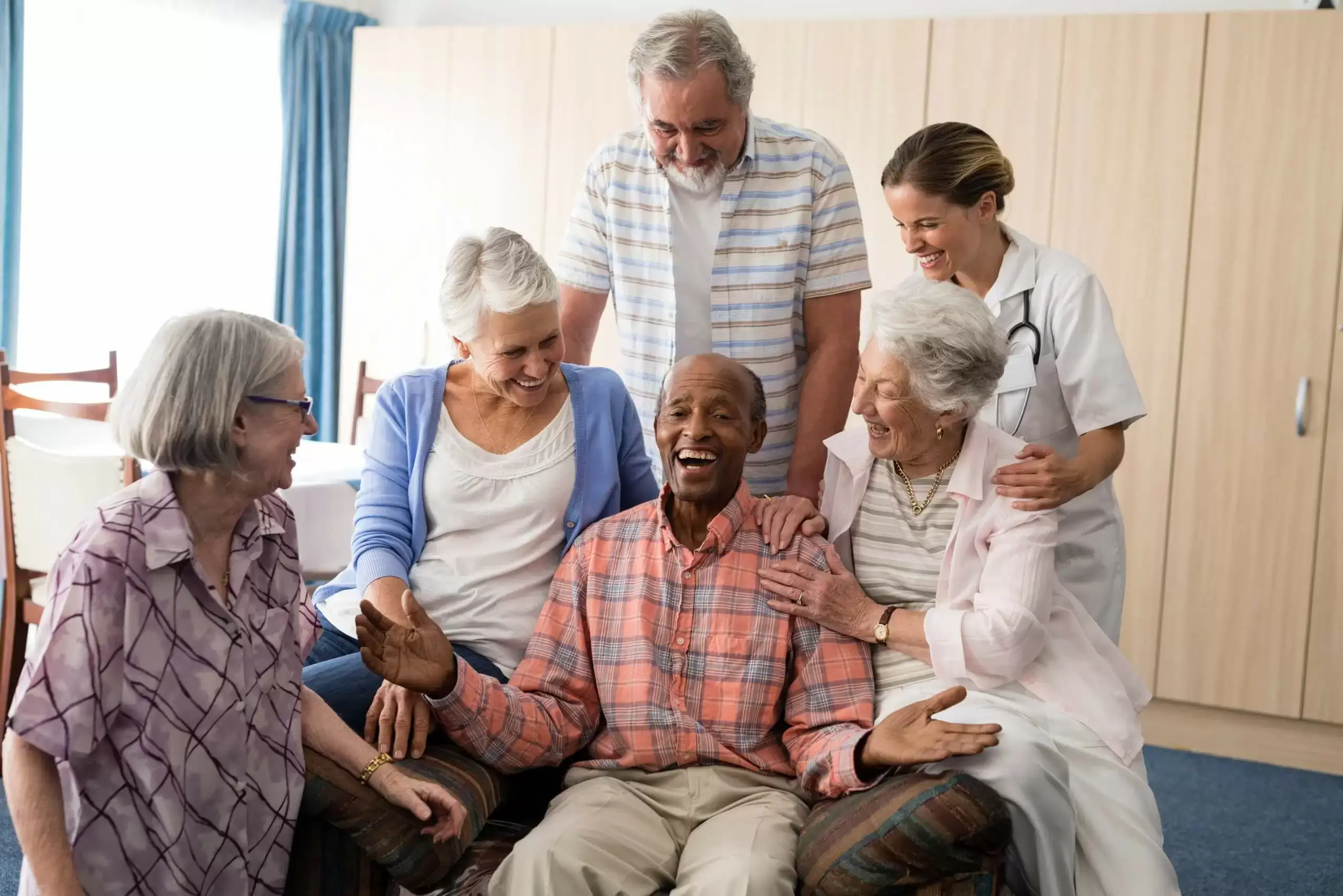Senior citizens helps old man get out of bed to help doctor check his health