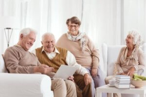 Senior citiens watching movie on laptop
