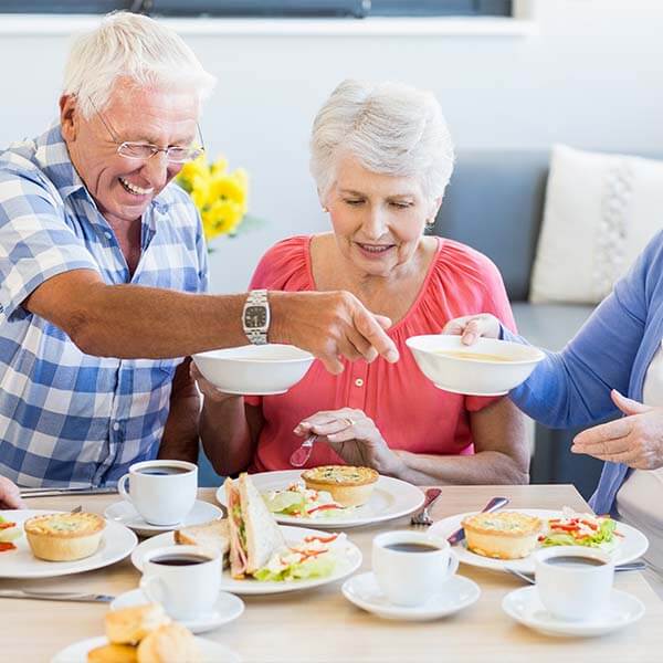 Senior citizens eating dinner