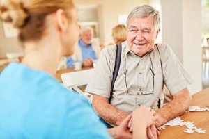 Caregiver checking old man's health