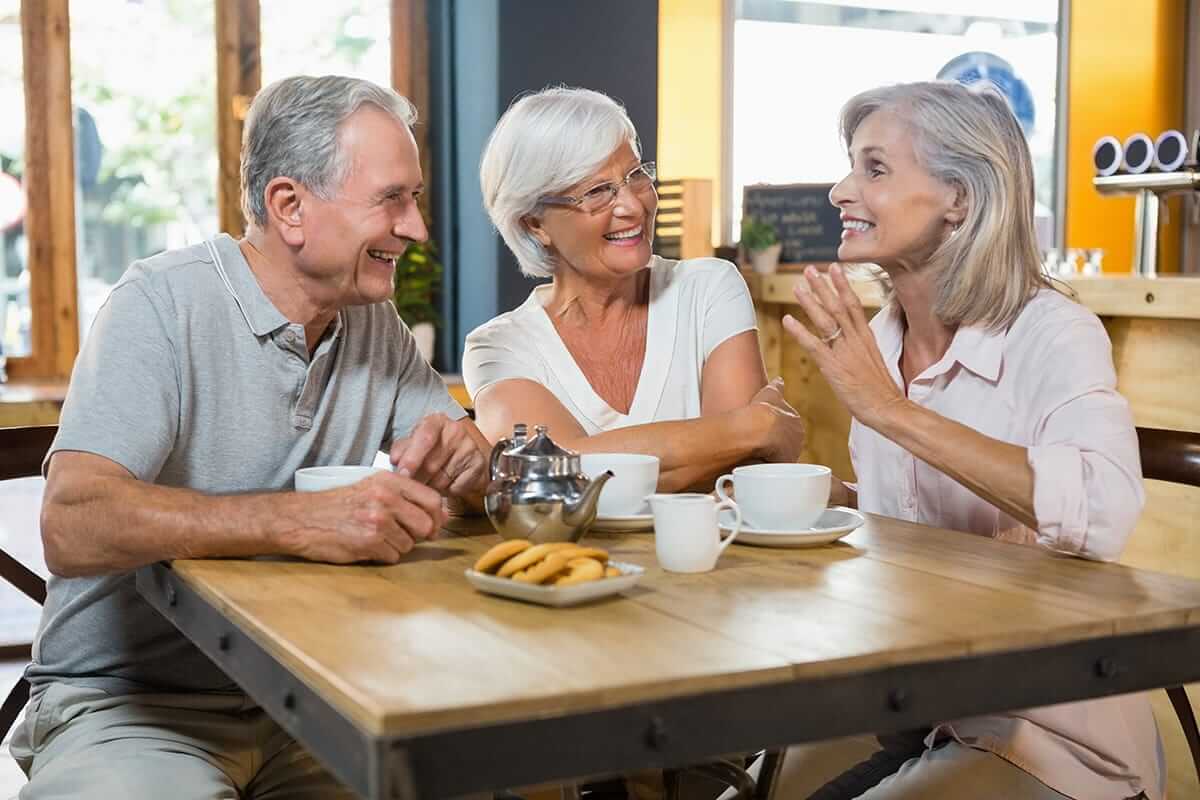 Senior citizens having breakfast together