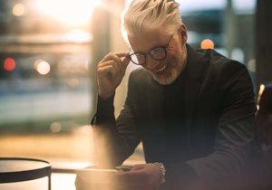 Happy old Man with a mobile phone