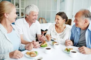 Senior citizens having lunch together