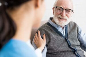 Old man having medical checkup with his private doctor