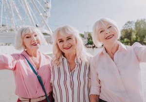 Senior citizens take a selfie during outdoor activities