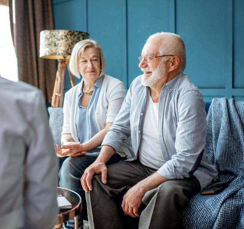 Senior couple have a conversation with caregiver