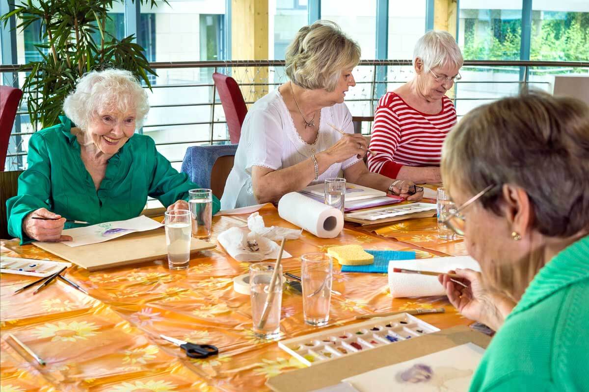 Senior living citizens enjoy the picture coloring game