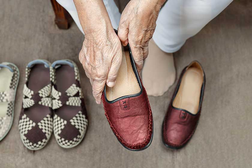 https://www.terrabellaseniorliving.com/wp-content/uploads/2023/05/elderly-woman-putting-on-shoes.jpg